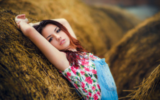 Woman hay bale field portrait - her hand free wallpaper