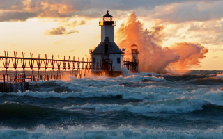 Lighthouse waves ocean sunset cloudy - photograph free wallpaper for desktop