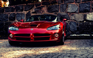 Red sports car stone wall 2 - a red sports car free wallpaper