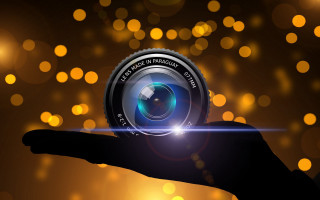 Hand camera lens bokeh city - a camera len free wallpaper