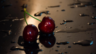 Cherry shiny surface water drops - a shiny surface free wallpaper for desktop