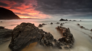 Rocky beach sunset clouds mountain - dark cloud free wallpaper for desktop