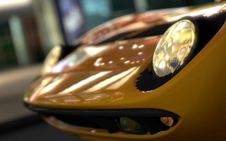 Yellow sports car closeup blurry - a yellow sports car free wallpaper