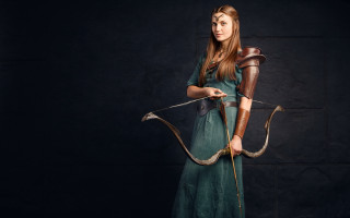 Woman green dress archer fantasy - a black background behind her free wallpaper for desktop
