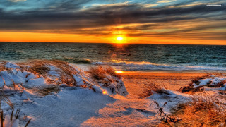 Sunset ocean beach snow grass - a sunset over the ocean free wallpaper