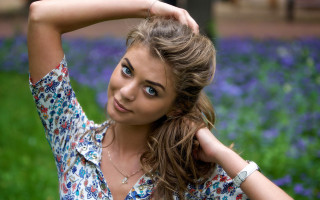 Woman flower shirt bokeh portrait - a picture in a field of flowers free wallpaper