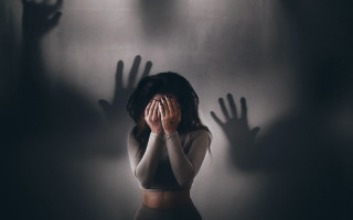 Woman hiding face shadow hands - front of her face free wallpaper