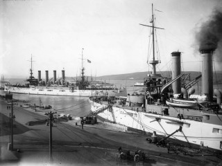 Large ship docked harbor smoke - panoramic free wallpaper