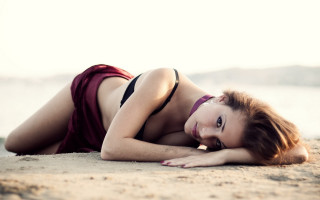 Beach bikini woman laying sand - a character portrait free wallpaper