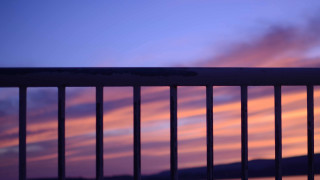 Sunset balcony fence bench pink - sky in the background free wallpaper for desktop