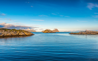Lake rocks islands sky matte - a rock formation in the middle of it free wallpaper