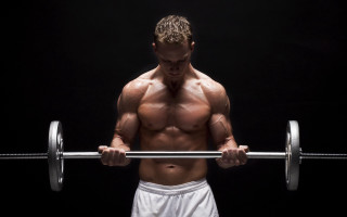 Muscular man barbell topless portrait - a barbell free wallpaper