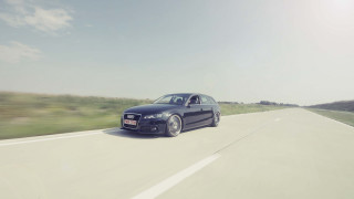 Black car driving road grass 2 - a field of grass and trees free wallpaper for desktop