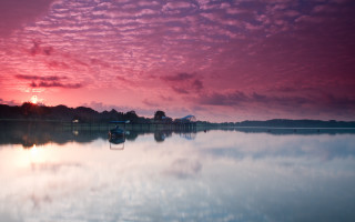 Boat sunset water pink clouds - rich moody colour free wallpaper
