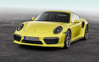 Yellow porsche sports car parking - a black floor free wallpaper
