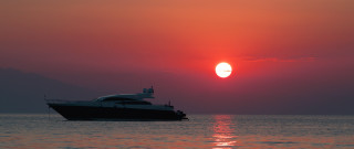 Boat sunset mountain ocean sky - a boat free wallpaper for desktop