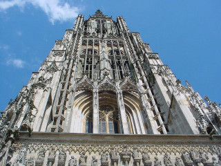 Tall building massive clock sky - free architecture wallpaper