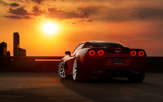 Red sports car sunset backlit - end free wallpaper