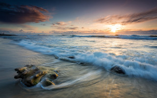 Beach waves sunset rock clouds - the shore and a sunset in the background free wallpaper
