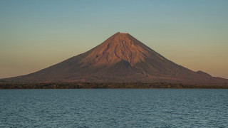 Mountain lake shore boat trees - a large mountain free wallpaper