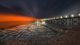 Pier lights night water cloudy - rich moody colour free wallpaper