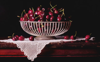Bowl cherries lace doily table - a cloth free wallpaper