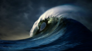 Large wave breaking dark sky - a dark sky in the background free wallpaper