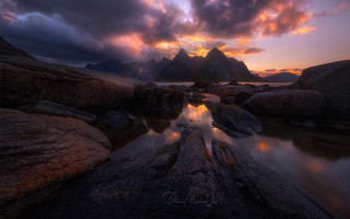 Sunset mountain river rocks cityscape - a sunset over a mountain range free wallpaper for desktop