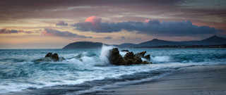 Wave rock beach sunset mountains - against free wallpaper