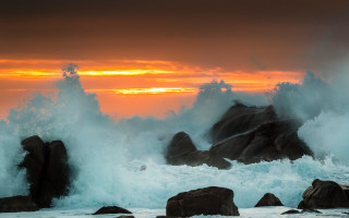 Large wave rocky shore sunset - against the rock free wallpaper