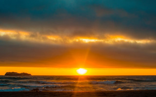 Sunset ocean island clouds beach 2 - a small island in the distance free wallpaper