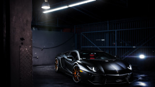 Black sports car garage night - black background free wallpaper