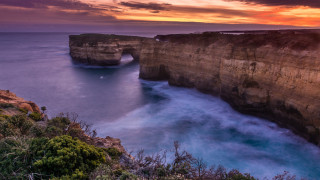 Sunset rocky cliff water bush - a rocky cliff free wallpaper