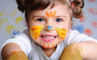 Smiling girl painted face blue - a childs drawing free wallpaper