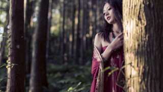 Woman red dress forest portrait - over her shoulder free wallpaper