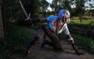 Woman cosplay sword forest night - a woman in a costume free wallpaper