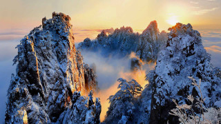 Snowy mountain sunset clouds forest - a sun free wallpaper