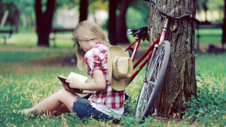 Girl bicycle reading tree grass - the grass next free wallpaper