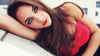 Woman longhair redshirt lying ledge - red shirt free wallpaper