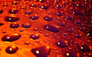 Metal water drops autumn fire - a close up of a metal surface free wallpaper