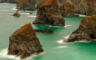 Rock cliff bird water impressionist - a group of rocks free wallpaper for desktop