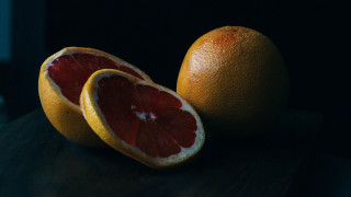 Grapefruits stilllife minimalism orange black - one cut free wallpaper