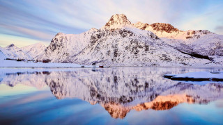Mountain lake reflection snowy horizon 2 - a lake in the foreground and a snow free wallpaper