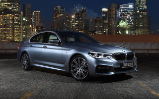 Silver car city skyline night 9 - a city skyline in the background free wallpaper for desktop