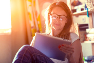 Woman glasses tablet couch window - affinity photo free wallpaper