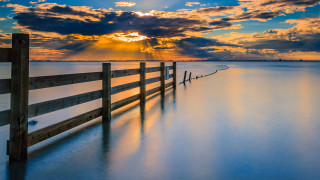 Wooden fence beach cloudy sky - top of a beach under a cloudy sky free wallpaper