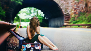 Woman sitting road suitcase tunnel - the side of a road free wallpaper for desktop