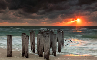 Wooden posts beach cloudy sunset - wooden post free wallpaper
