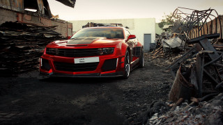 Red car dirty lot building - autodestructive art free wallpaper