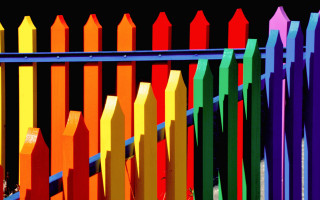 Colorful fence rainbow topper saturated - a black background and a rainbow free wallpaper